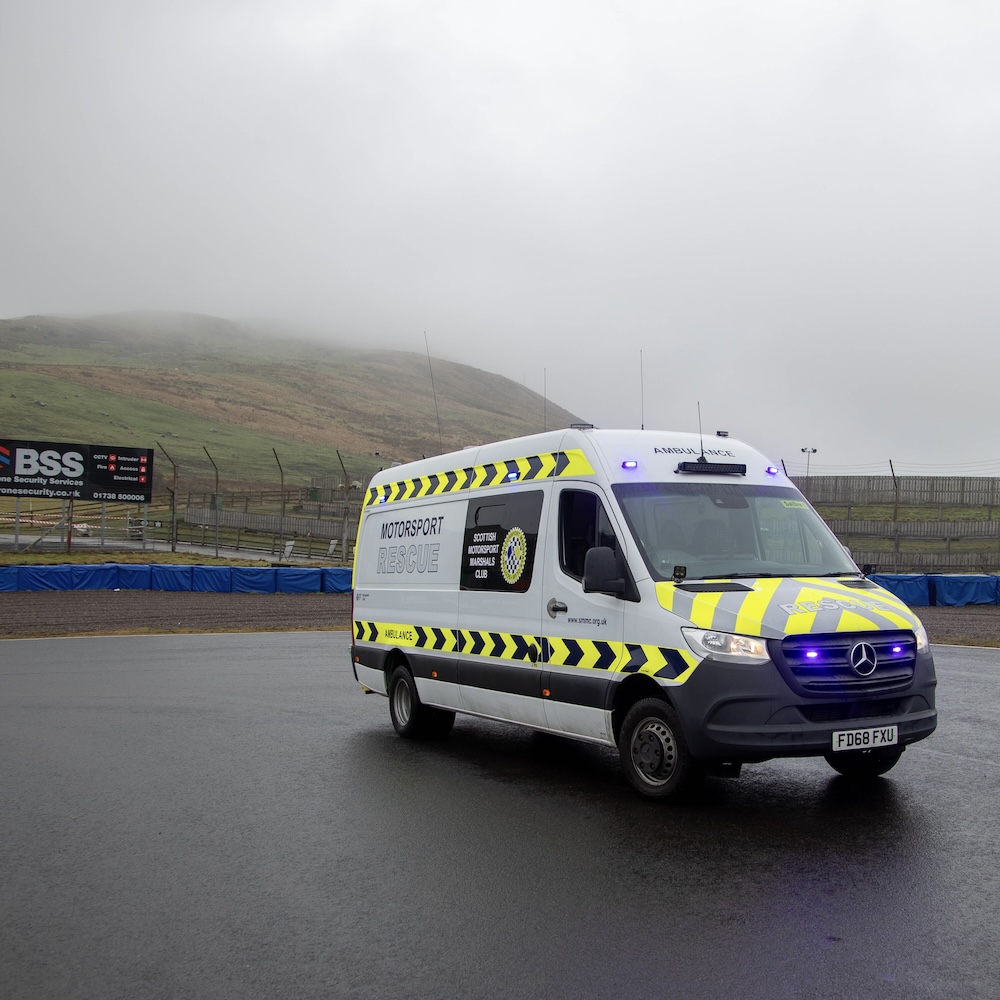 SMMC Motorsport Rescue Ambulance in front of the iconic Knock Hill